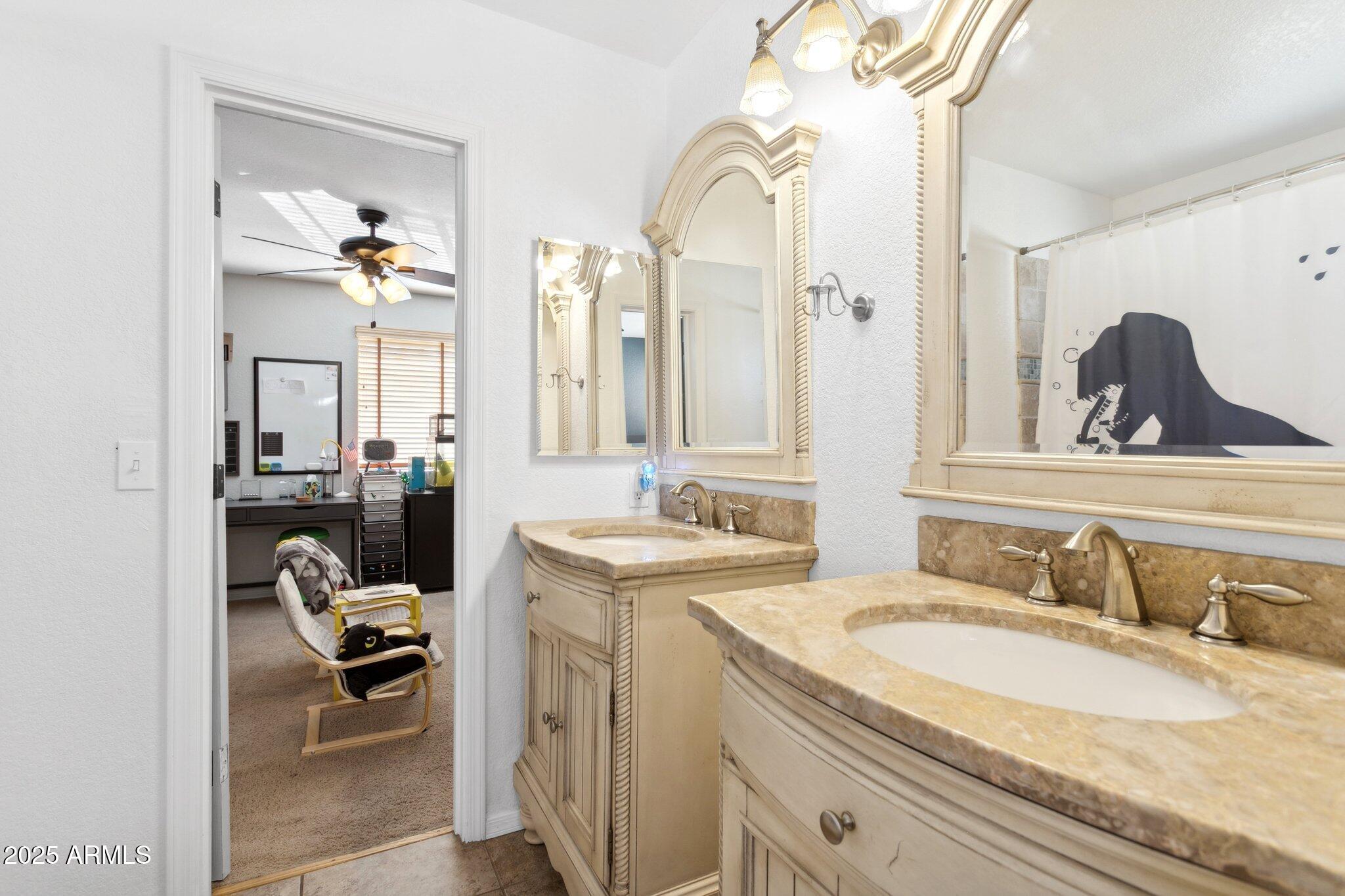 1255 West Sea Shell Drive Gilbert, AZ 85233 - Photo 14 of 35 a en suite bathroom with a granite countertop sink and a mirror