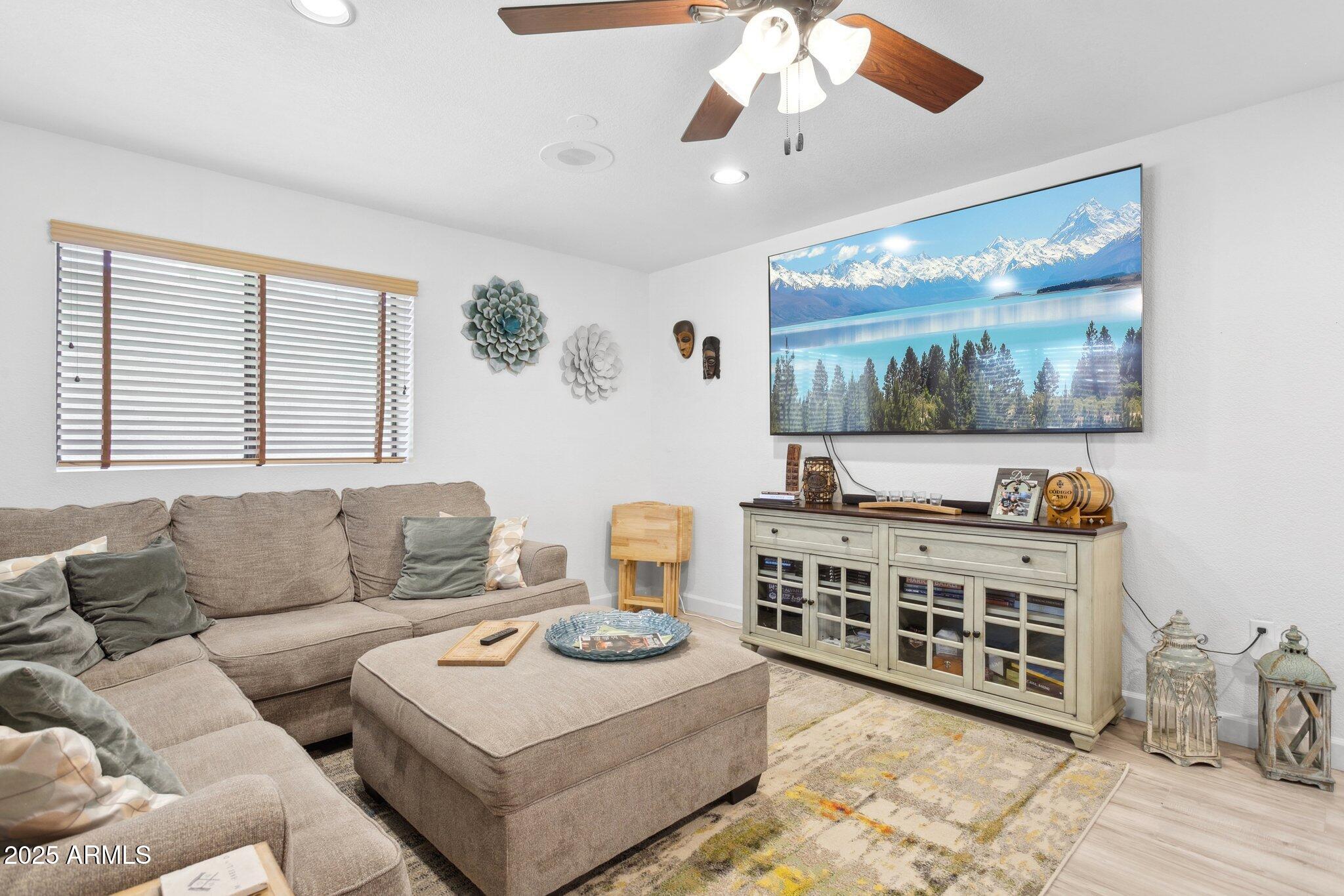 1255 West Sea Shell Drive Gilbert, AZ 85233 - Photo 18 of 35 a living room with furniture and a flat screen tv