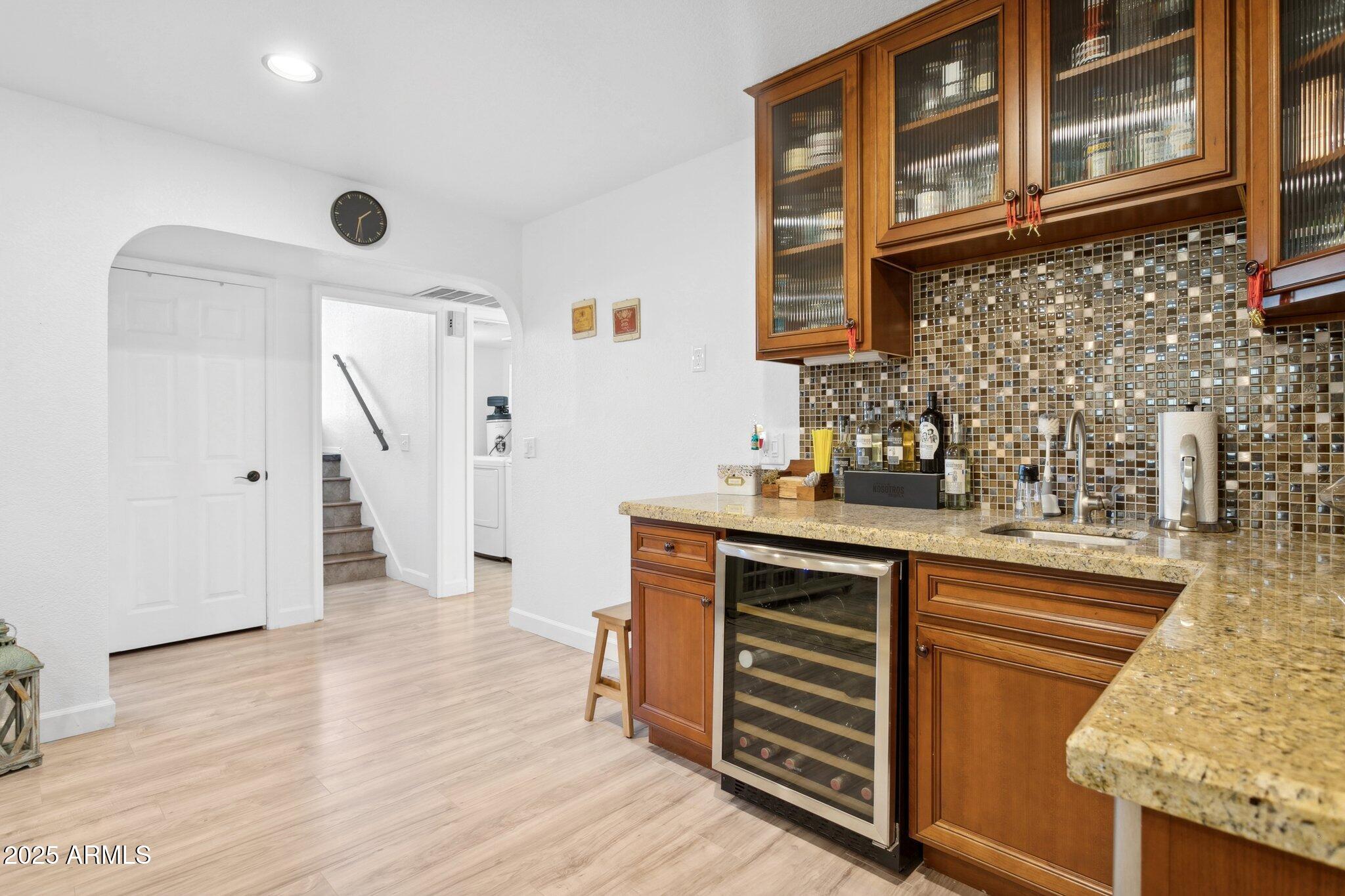 1255 West Sea Shell Drive Gilbert, AZ 85233 - Photo 19 of 35 a kitchen with granite countertop a sink and wooden floor