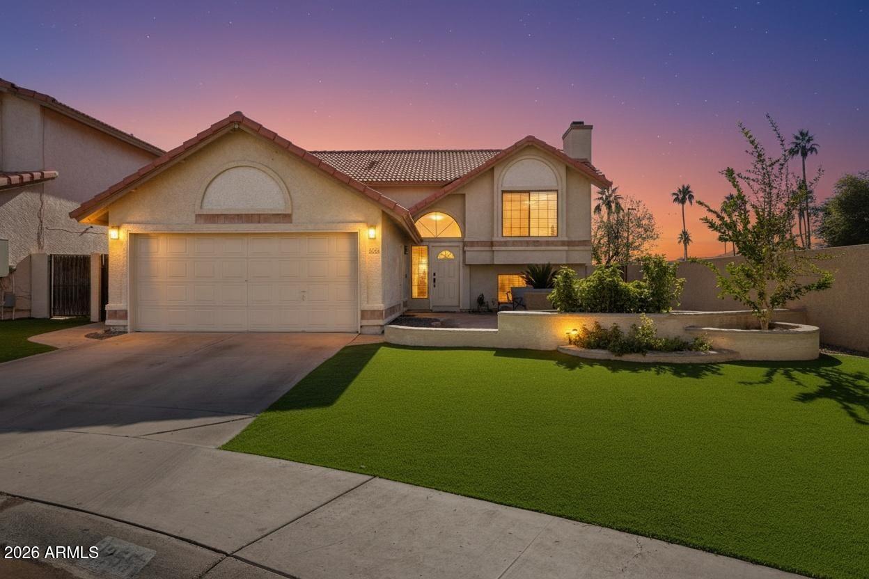 1255 West Sea Shell Drive Gilbert, AZ 85233 - Photo 2 of 35 a front view of a house with garden