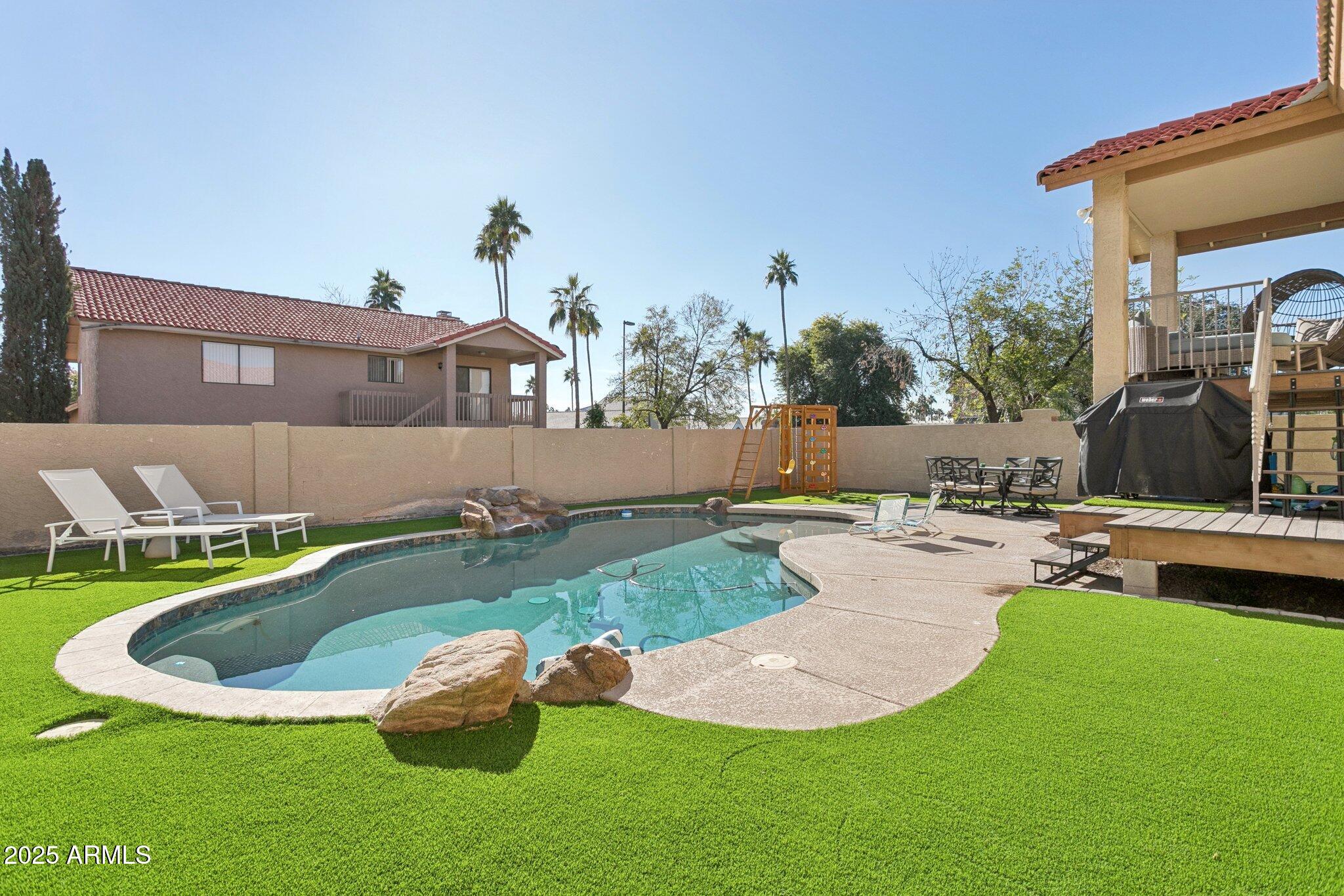 1255 West Sea Shell Drive Gilbert, AZ 85233 - Photo 2 of 34 a view of a backyard with sitting area