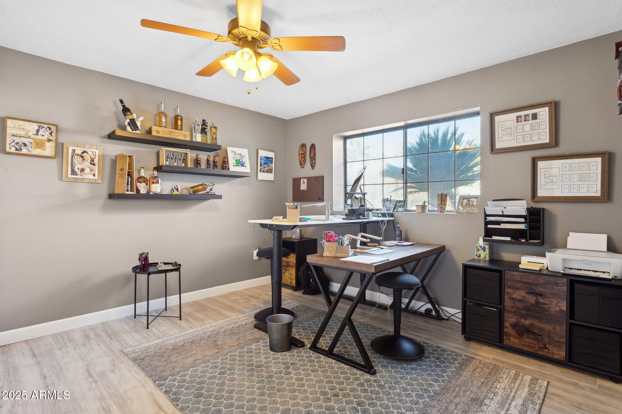1255 West Sea Shell Drive Gilbert, AZ 85233 - Photo 23 of 34 a view of a workspace with furniture window and wooden floor