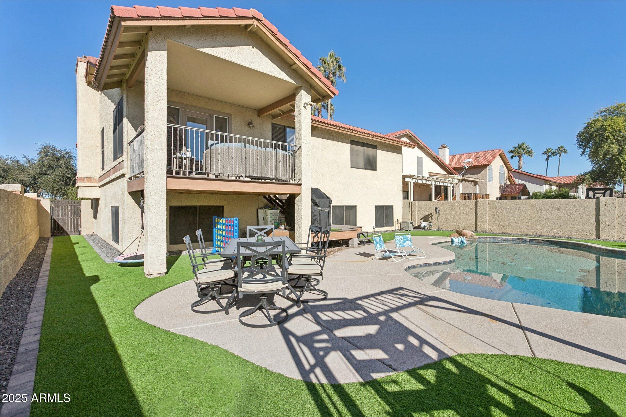 1255 West Sea Shell Drive Gilbert, AZ 85233 - Photo 26 of 34 a view of a patio with couches table and chairs and potted plants
