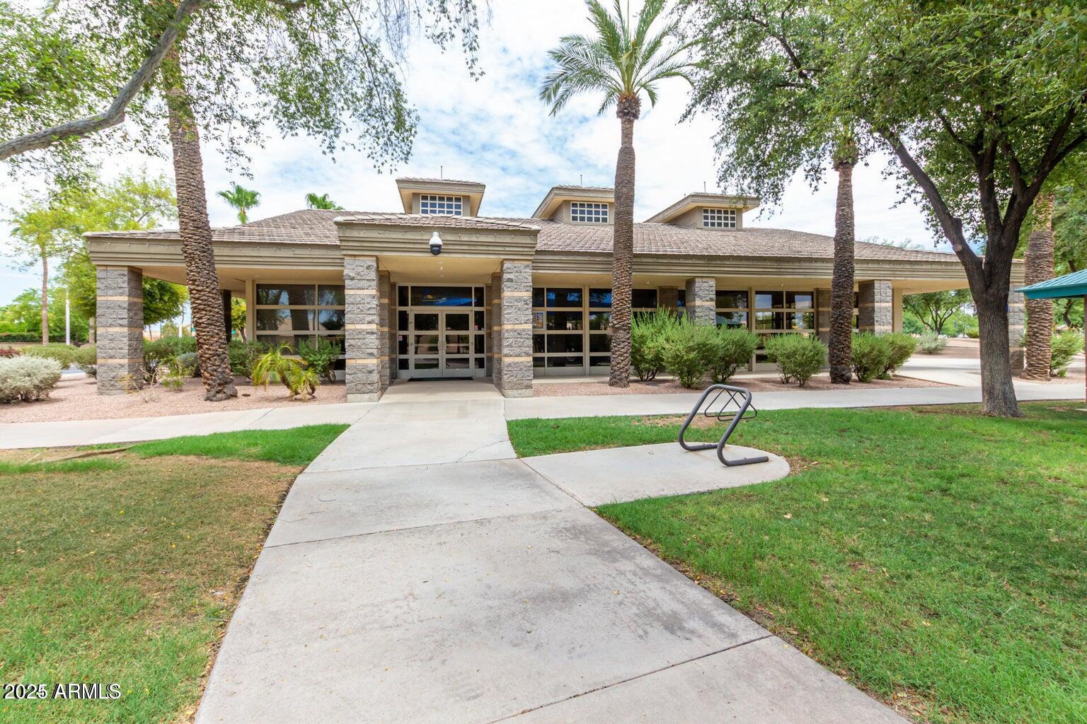 1255 West Sea Shell Drive Gilbert, AZ 85233 - Photo 30 of 34 a front view of a building with garden and trees
