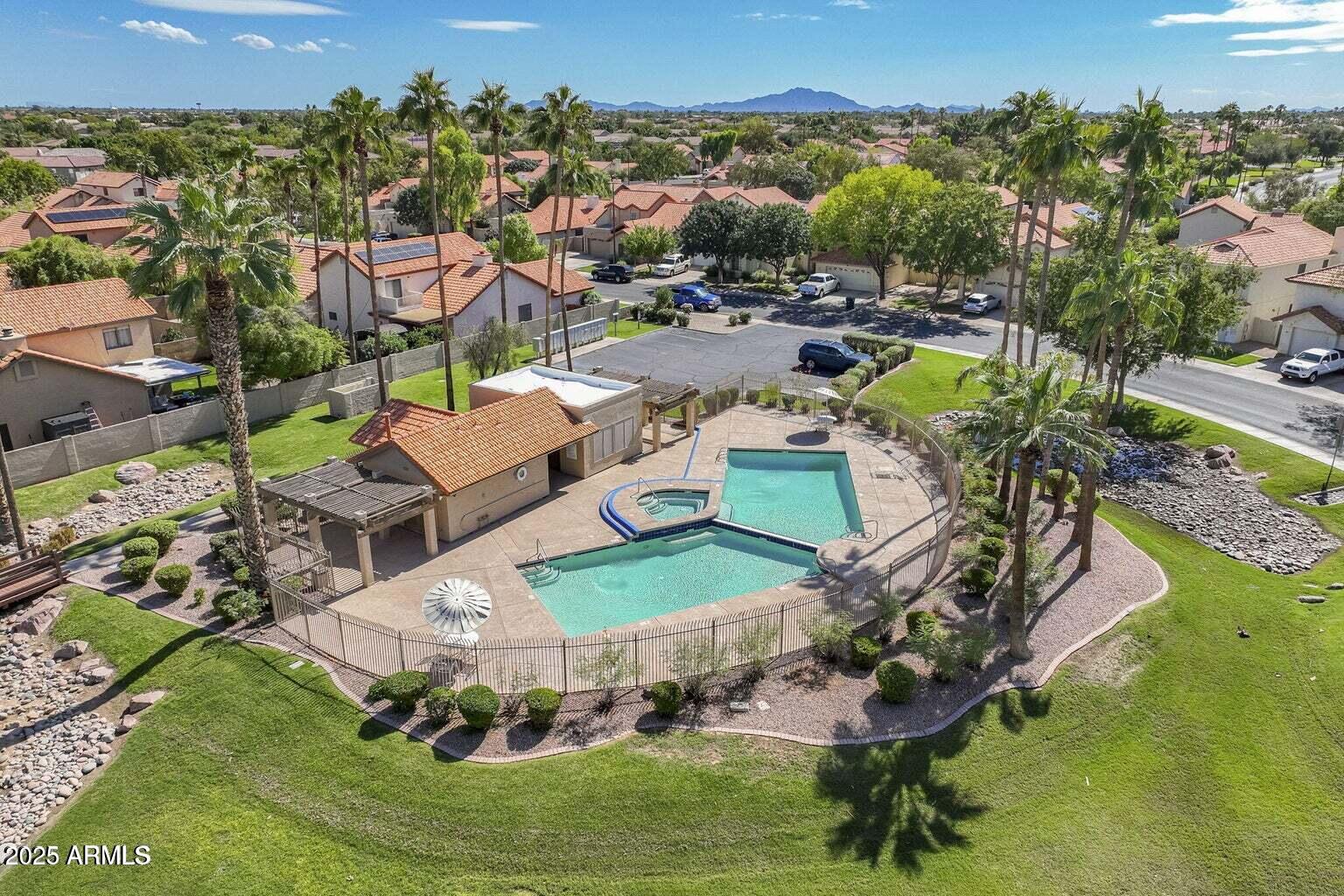 1255 West Sea Shell Drive Gilbert, AZ 85233 - Photo 34 of 34 a view of a swimming pool with lawn chairs