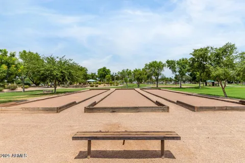 a view of a swimming pool with a yard
