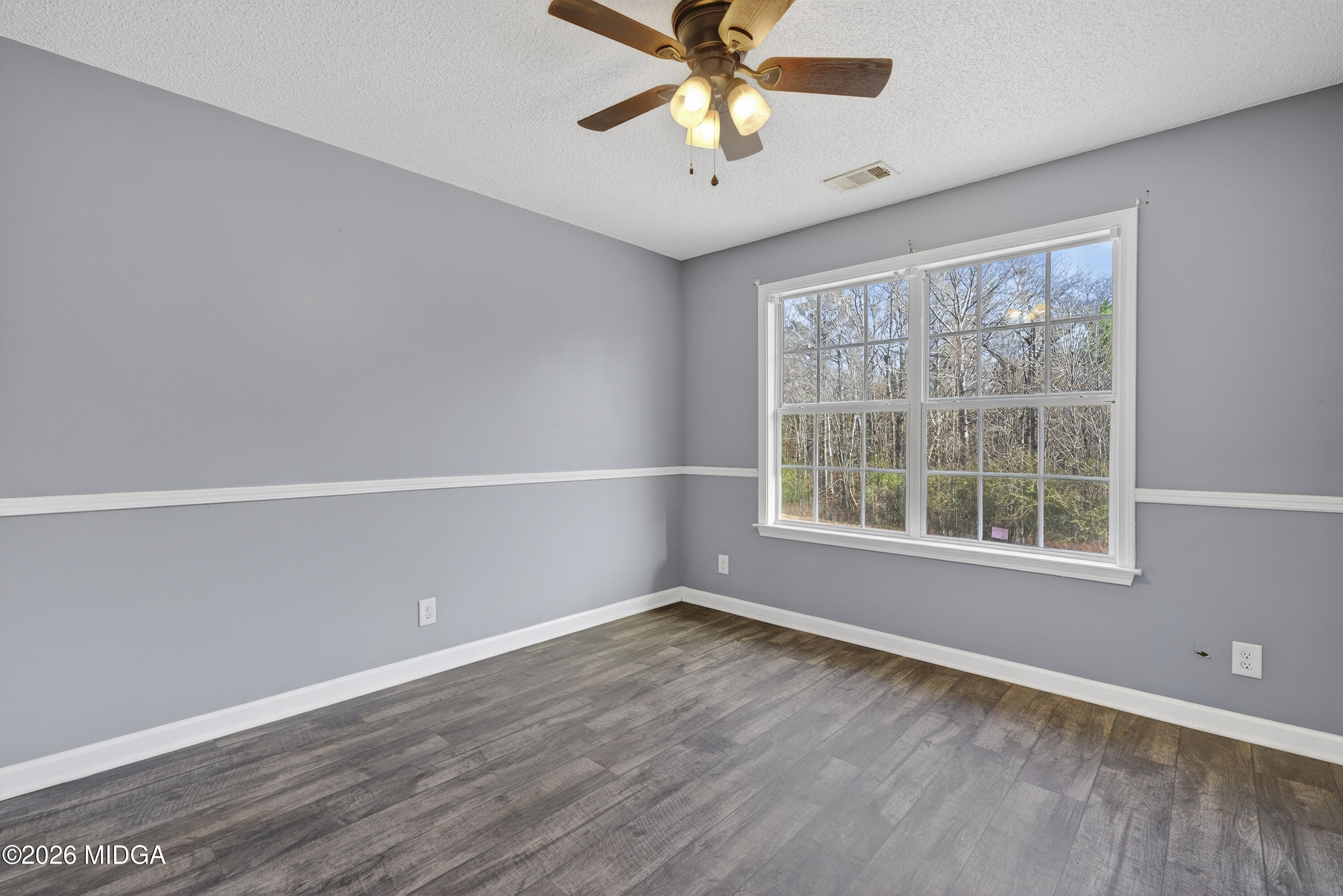 226 Amy Lane Gray, GA 31032 - Photo 23 of 46 an empty room with a window and a fan