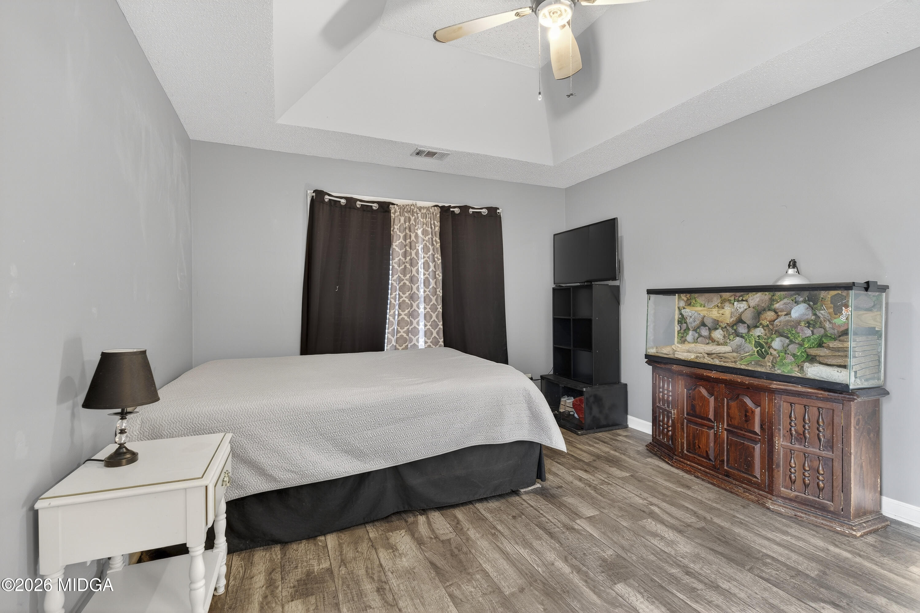 226 Amy Lane Gray, GA 31032 - Photo 27 of 46 a bedroom with a bed and a flat tv screen on dresser