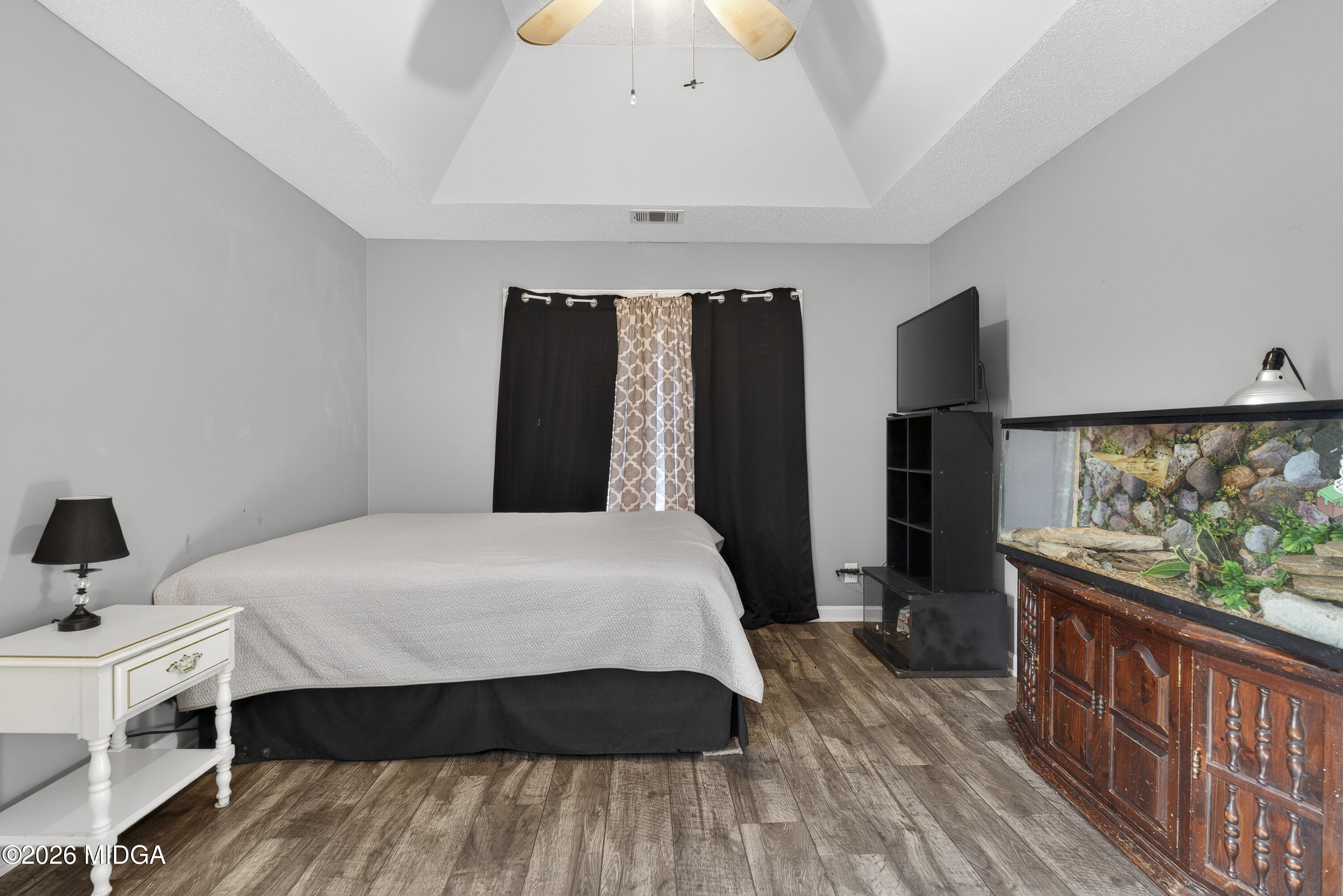 226 Amy Lane Gray, GA 31032 - Photo 28 of 46 a bedroom with a bed and wooden floor