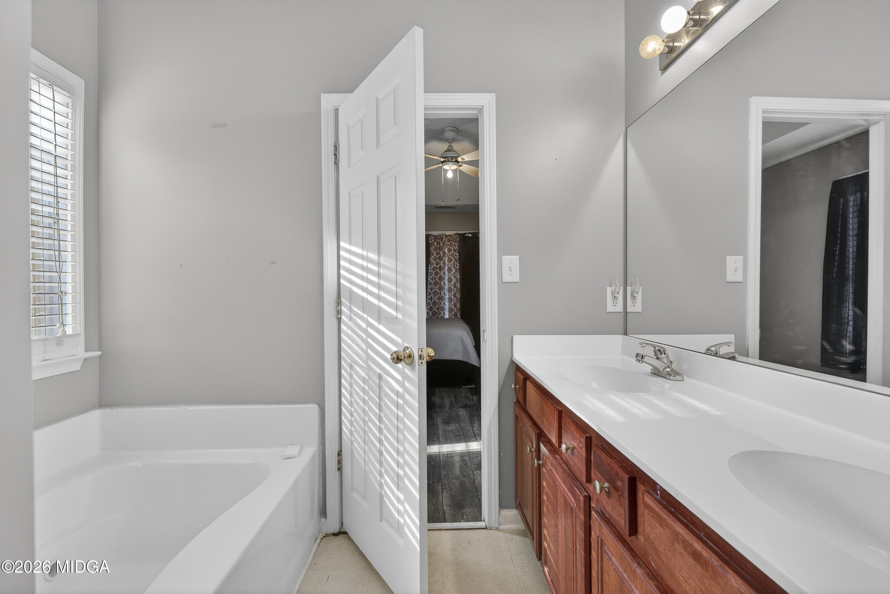226 Amy Lane Gray, GA 31032 - Photo 31 of 46 a bathroom with a double vanity sink and a bathtub