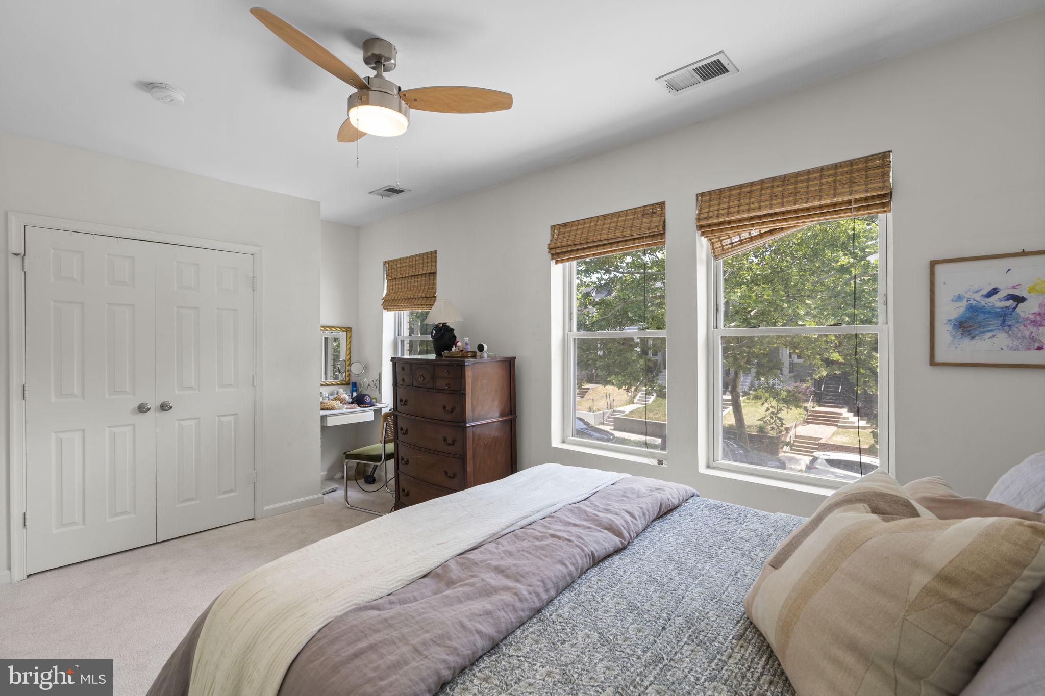 1712 M Street Northeast Washington, DC 20002 - Photo 13 of 38 a bedroom with a large bed and a large window