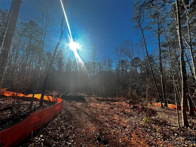 a backyard of a house with a yard and outdoor seating