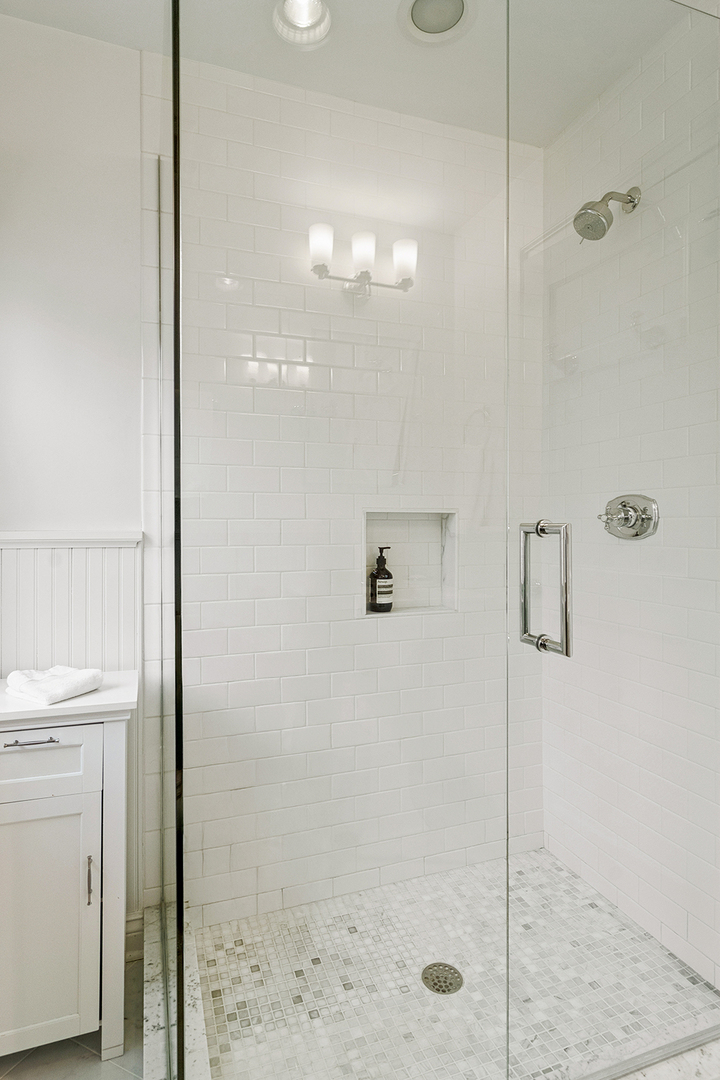 135 South Maywood Road Lake Forest, IL 60045 - Photo 22 of 35 a bathroom with a shower a mirror and a shower