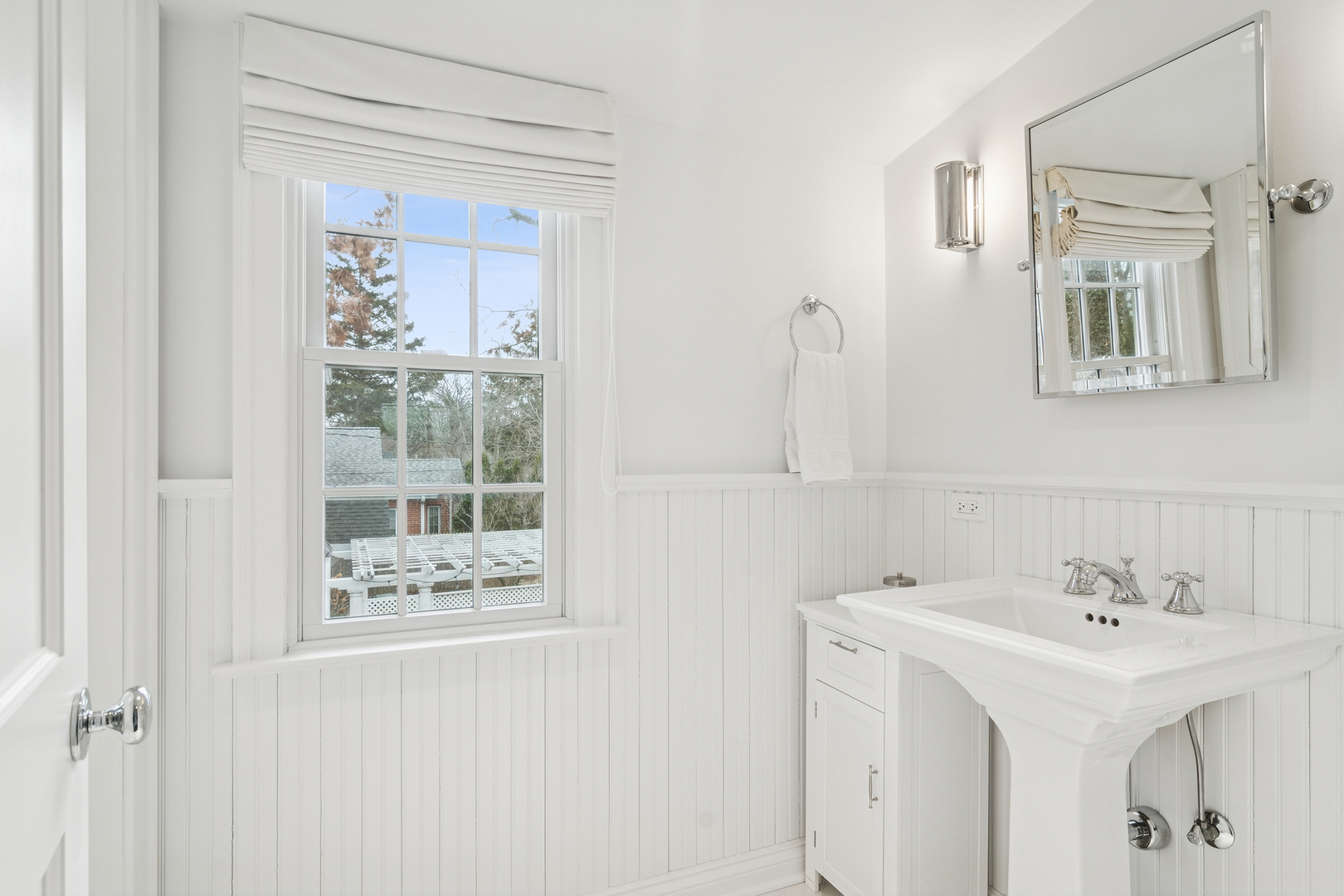 135 South Maywood Road Lake Forest, IL 60045 - Photo 27 of 35 a bathroom with a sink a mirror and a window