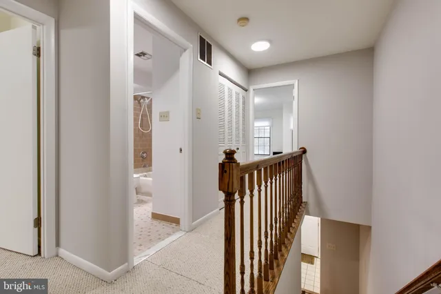 a view of a hallway with entryway door