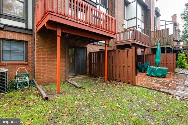 a backyard of a building with barbeque area and entertaining space