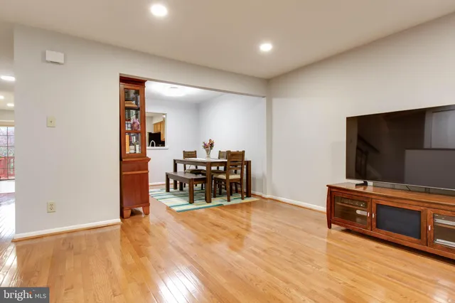 a livingroom with furniture and a flat screen tv