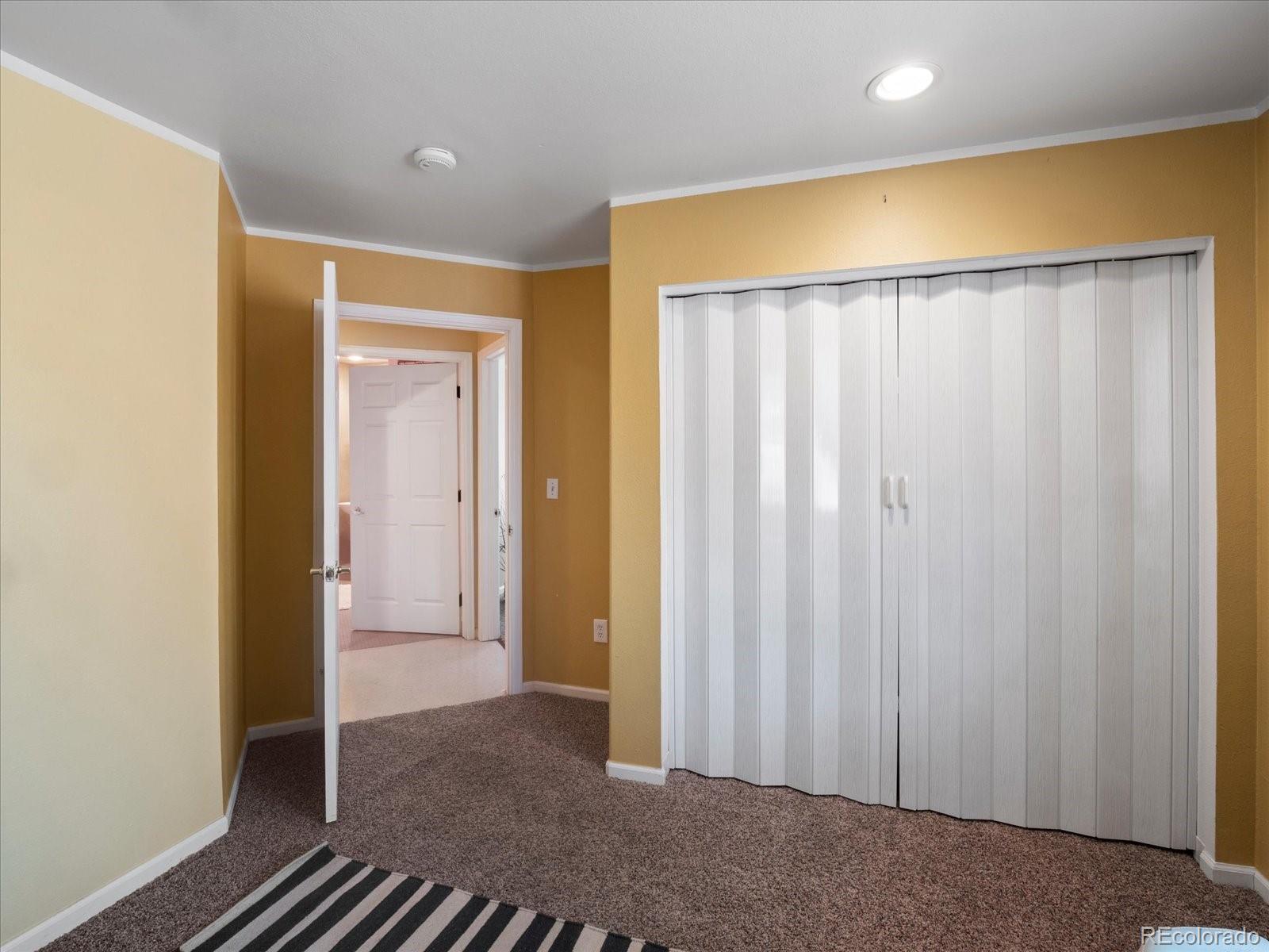 1910 South Decatur Street, Unit B Denver, CO 80219 - Photo 10 of 13 a view of a hallway with closet area