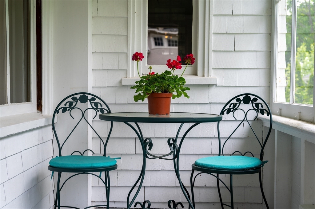15 Brier Road Gloucester, MA 01930 - Photo 15 of 38 a table and chairs in a room and table with wooden floor