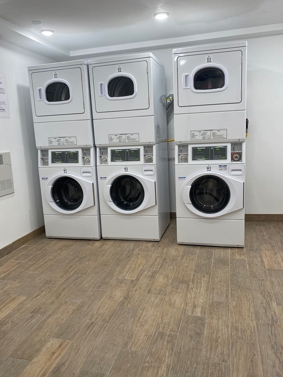 16 5th Street, Unit 6 Chelsea, MA 02150 - Photo 7 of 7 a view of a storage and utility room with a washer and dryer