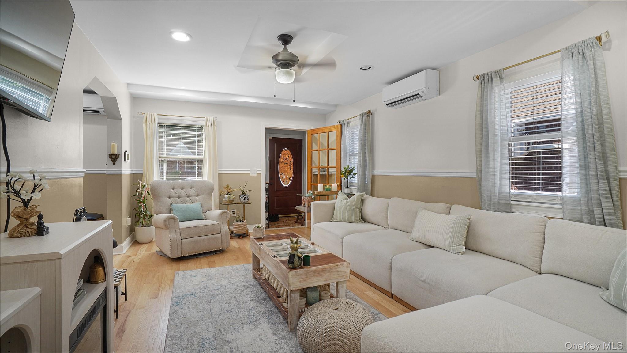 172-17 Amelia Road Queens, NY 11434 - Photo 4 of 18 a living room with furniture and a large window