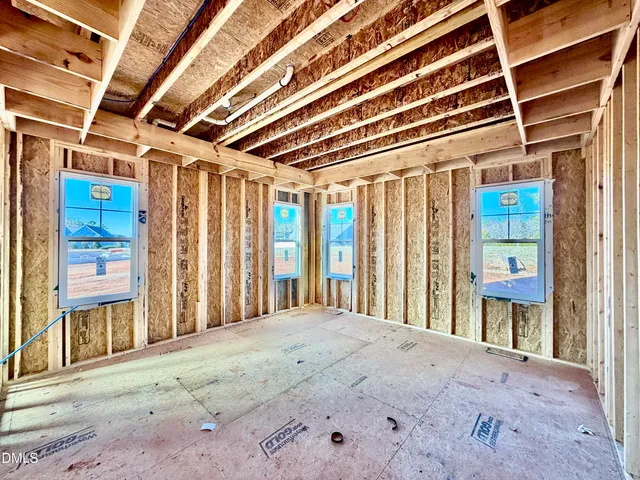a view of a room with wooden walls