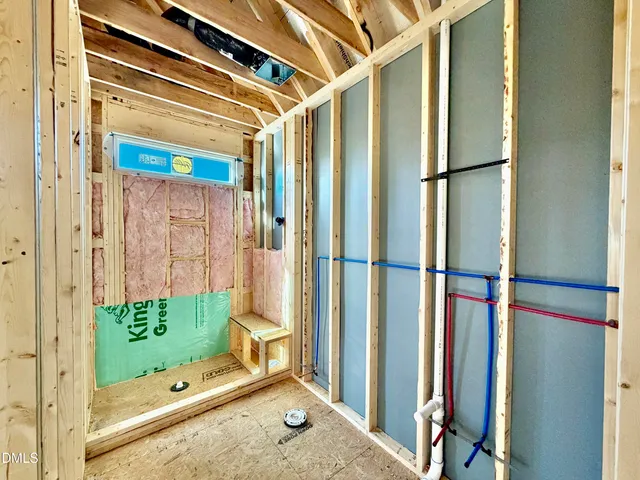 a bathroom with a tub and shower