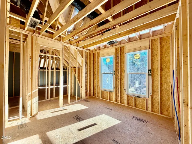 a view of a balcony with wooden floor and door