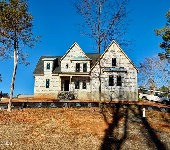 a view of a house with snow on the roof