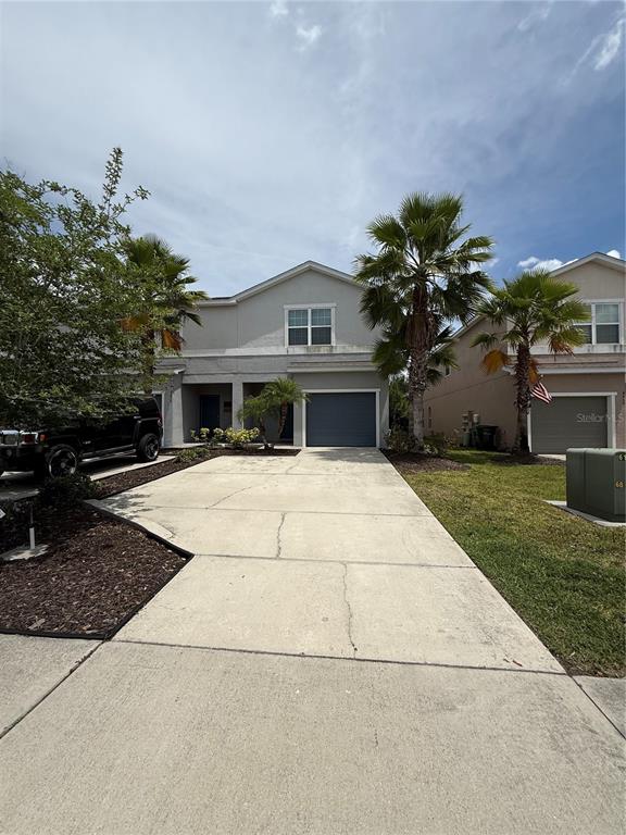 4656 Vignette Way Sarasota, FL 34240 - Photo 1 of 33 a house with garden in front of it