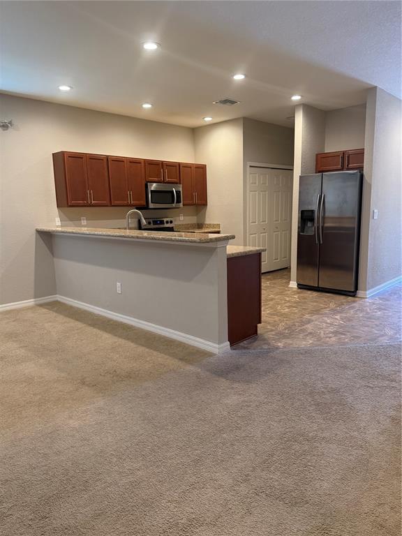 4656 Vignette Way Sarasota, FL 34240 - Photo 13 of 33 a view of kitchen with stainless steel appliances refrigerator oven and microwave