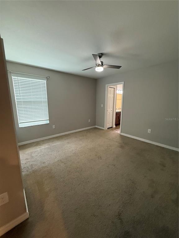 4656 Vignette Way Sarasota, FL 34240 - Photo 25 of 33 an empty room with a empty space and windows