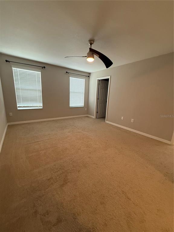 4656 Vignette Way Sarasota, FL 34240 - Photo 29 of 33 a view of an empty room with window and fireplace