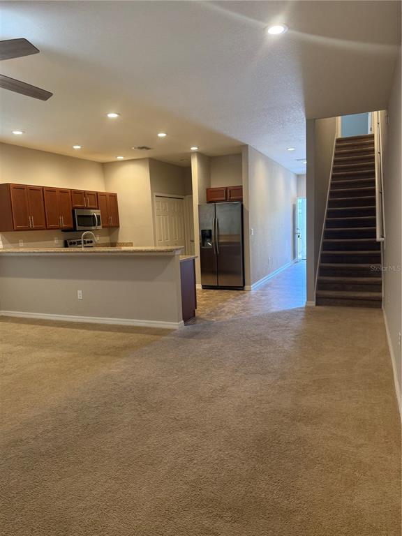 4656 Vignette Way Sarasota, FL 34240 - Photo 10 of 33 a view of a kitchen with a sink and a refrigerator