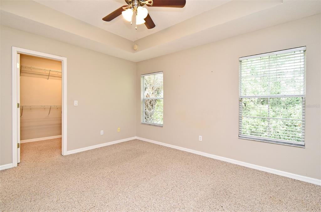 5072 Cypress Branch Point Oviedo, FL 32765 - Photo 12 of 23 an empty room with windows and fan