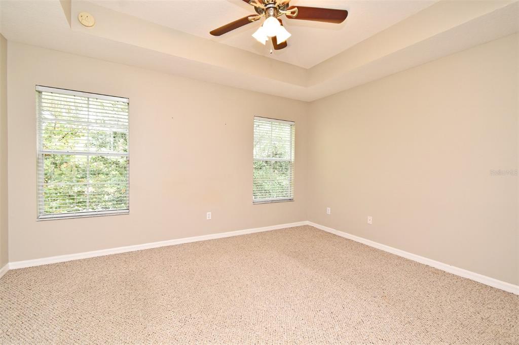 5072 Cypress Branch Point Oviedo, FL 32765 - Photo 3 of 23 an empty room with a window and a fan
