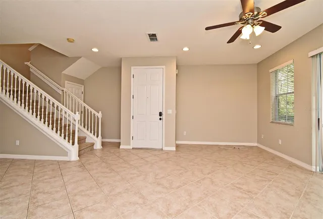 an entryway in a hall with a window
