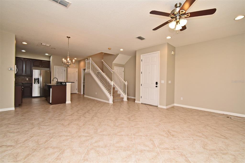 5072 Cypress Branch Point Oviedo, FL 32765 - Photo 5 of 23 wooden floor in an empty room with a ceiling fan