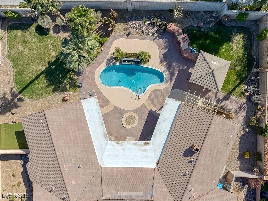 9 Quail Run Road Henderson, NV 89014 - Photo 52 of 57 An aerial perspective reveals a backyard oasis with a pristine swimming pool and mature desert landscaping.