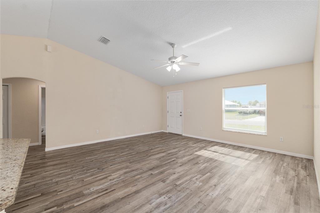 22 Juniper Loop Circle Ocala, FL 34480 - Photo 17 of 53 an empty room with wooden floor and window
