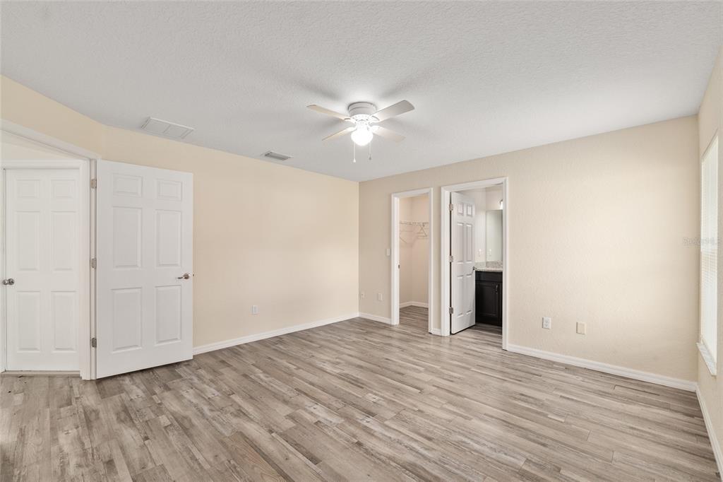22 Juniper Loop Circle Ocala, FL 34480 - Photo 32 of 53 a view of an empty room with wooden floor