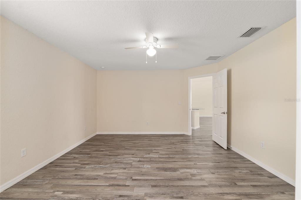 22 Juniper Loop Circle Ocala, FL 34480 - Photo 33 of 53 wooden floor in an empty room