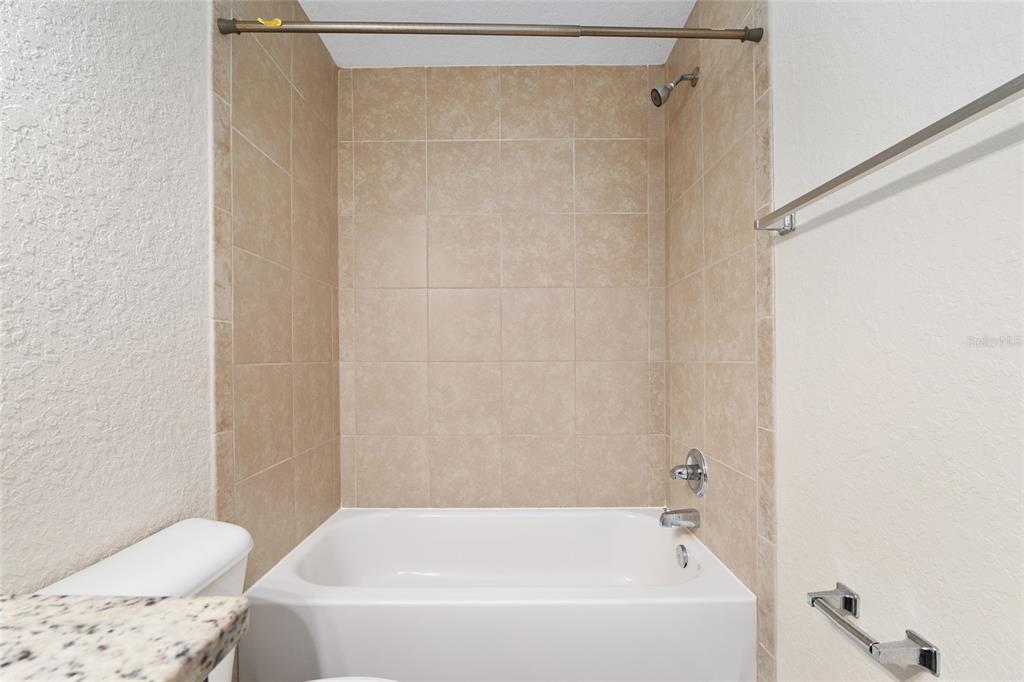 22 Juniper Loop Circle Ocala, FL 34480 - Photo 35 of 53 a bathroom with a bathtub and shower