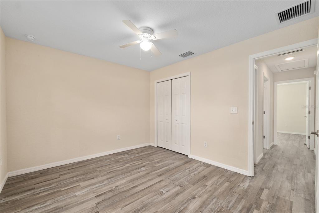 22 Juniper Loop Circle Ocala, FL 34480 - Photo 38 of 53 a view of an empty room with wooden floor