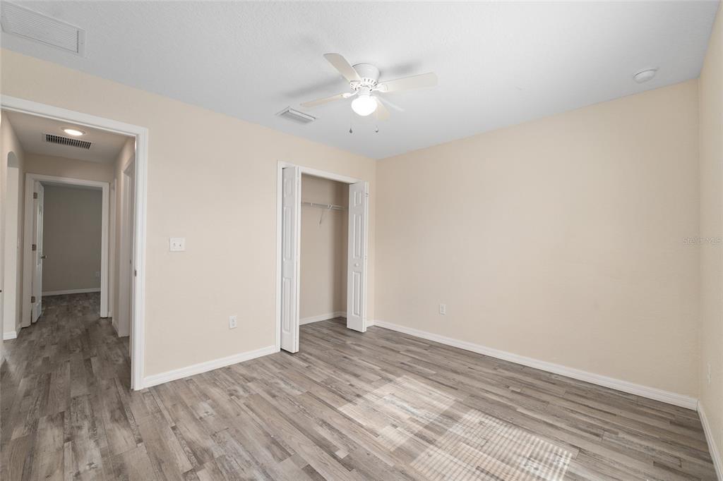 22 Juniper Loop Circle Ocala, FL 34480 - Photo 41 of 53 a view of an empty room with wooden floor