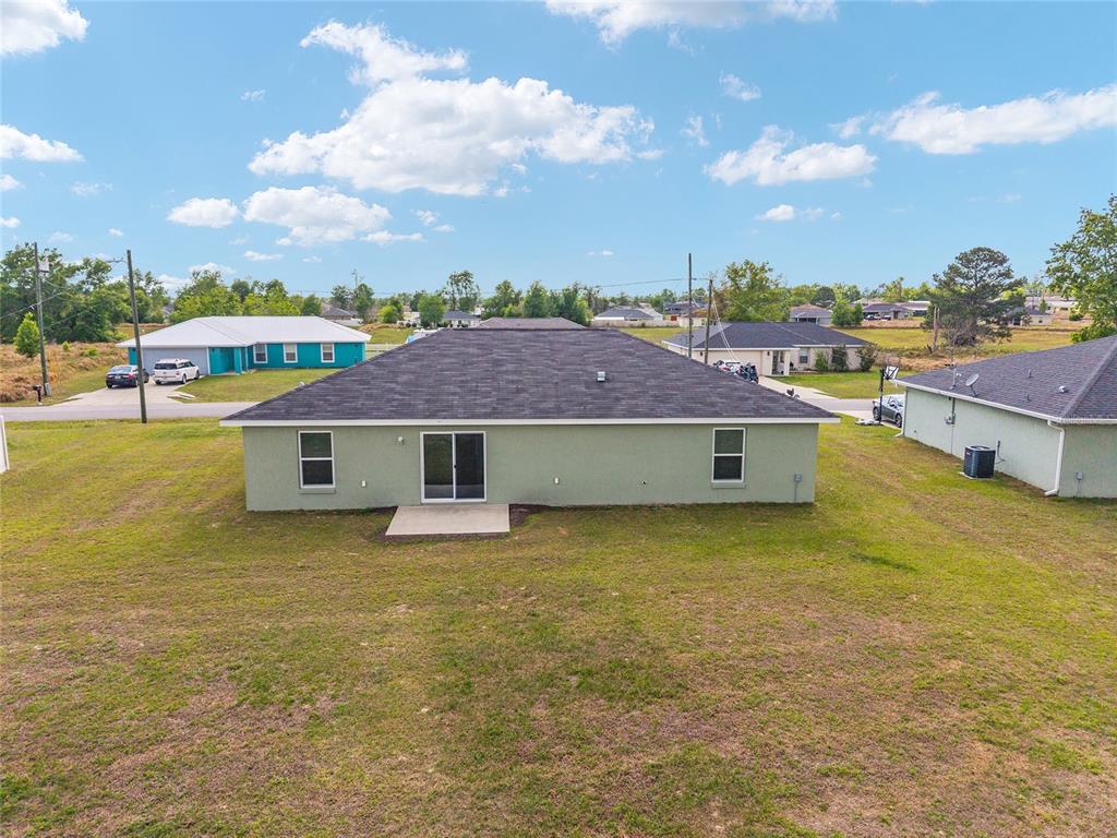 22 Juniper Loop Circle Ocala, FL 34480 - Photo 50 of 53 a view of a house with a garden