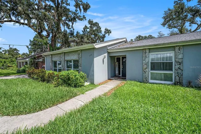 a view of an house with backyard space and garden