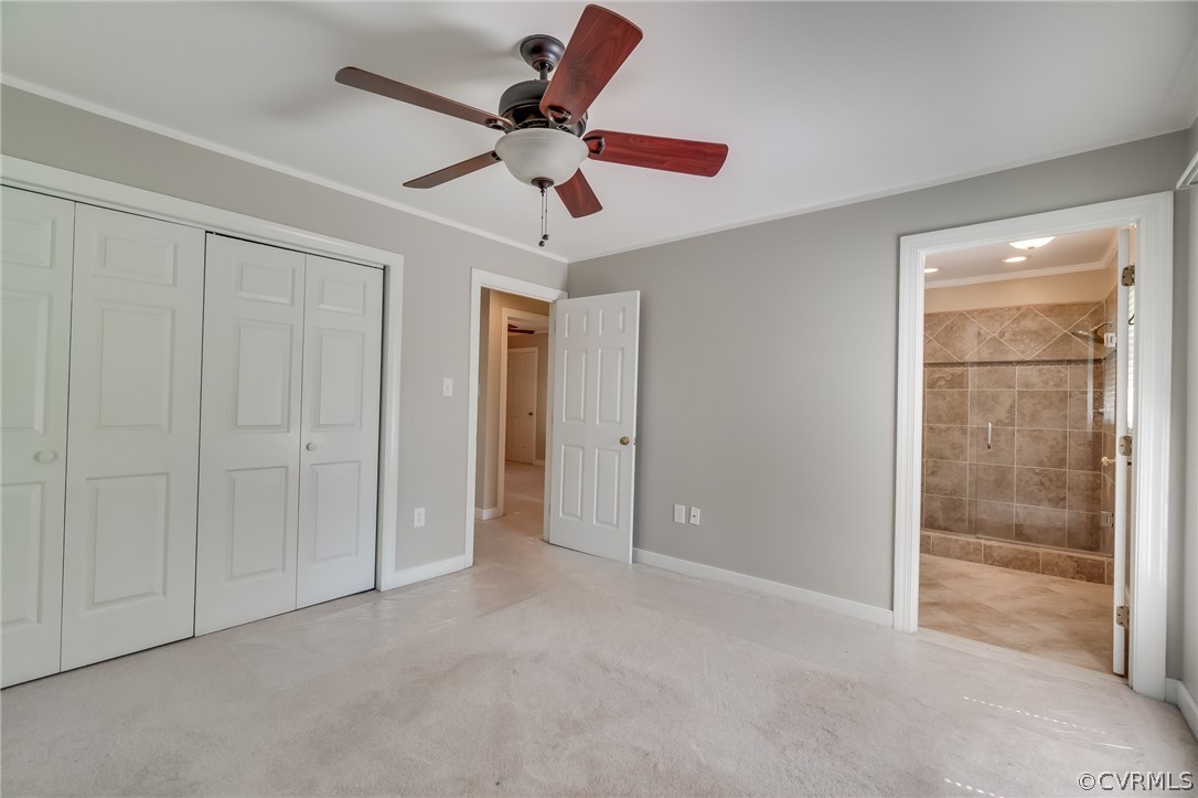 7512 Tangle Ridge Drive Mechanicsville, VA 23111 - Photo 12 of 23 an empty room with closet and a chandelier fan