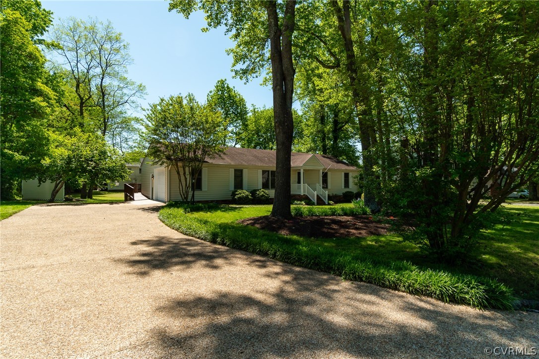 7512 Tangle Ridge Drive Mechanicsville, VA 23111 - Photo 19 of 23 a front view of a house with a yard and tree s