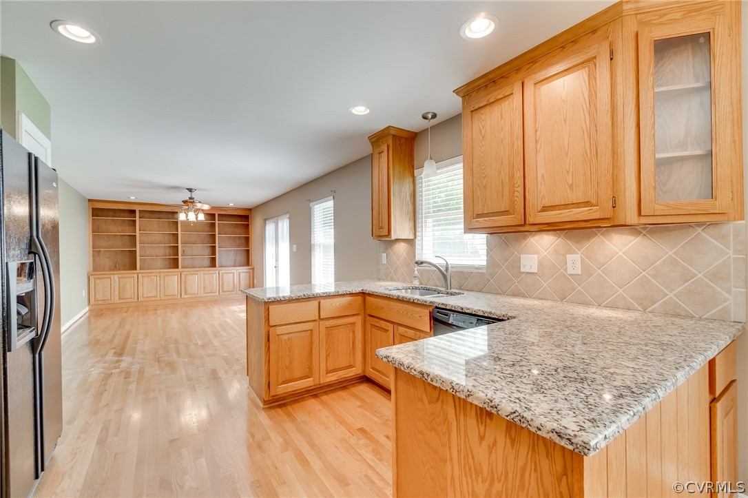 7512 Tangle Ridge Drive Mechanicsville, VA 23111 - Photo 5 of 23 a kitchen with granite countertop a sink a counter top space and cabinets